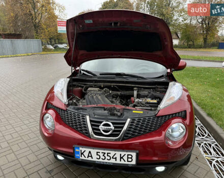 Червоний Ніссан Жук, об'ємом двигуна 1.6 л та пробігом 151 тис. км за 9900 $, фото 8 на Automoto.ua