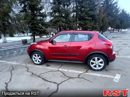 Червоний Ніссан Жук, об'ємом двигуна 1.6 л та пробігом 100 тис. км за 11520 $, фото 1 на Automoto.ua