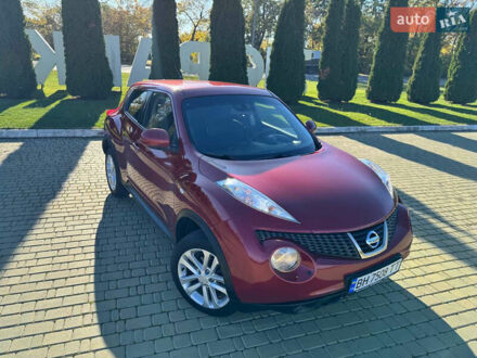 Красный Ниссан Жук, объемом двигателя 1.6 л и пробегом 169 тыс. км за 9800 $, фото 1 на Automoto.ua