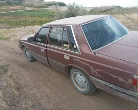 Красный Ниссан Лаурел, объемом двигателя 2.8 л и пробегом 500 тыс. км за 1300 $, фото 1 на Automoto.ua