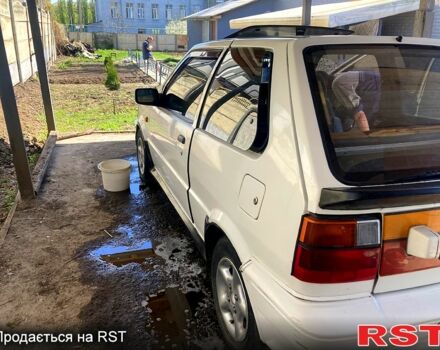 Белый Ниссан Марч, объемом двигателя 11 л и пробегом 298 тыс. км за 1400 $, фото 1 на Automoto.ua