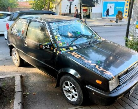 Черный Ниссан Марч, объемом двигателя 1 л и пробегом 200 тыс. км за 500 $, фото 1 на Automoto.ua