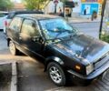 Черный Ниссан Марч, объемом двигателя 1 л и пробегом 200 тыс. км за 500 $, фото 1 на Automoto.ua