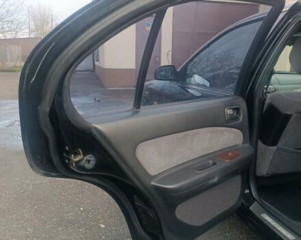 Черный Ниссан Максима, объемом двигателя 2 л и пробегом 291 тыс. км за 2850 $, фото 9 на Automoto.ua