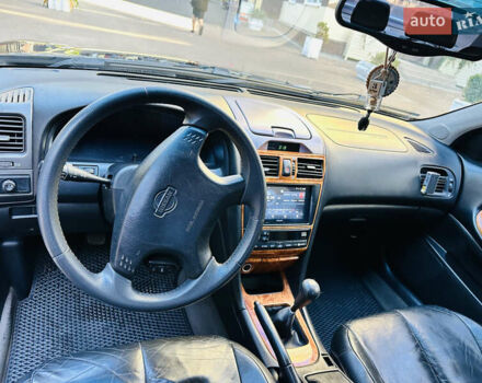 Черный Ниссан Максима, объемом двигателя 2 л и пробегом 197 тыс. км за 5400 $, фото 18 на Automoto.ua