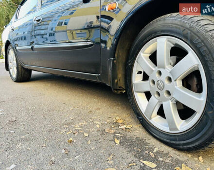 Черный Ниссан Максима, объемом двигателя 2 л и пробегом 197 тыс. км за 5400 $, фото 30 на Automoto.ua