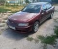 Красный Ниссан Максима, объемом двигателя 2 л и пробегом 270 тыс. км за 1800 $, фото 1 на Automoto.ua