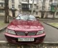 Червоний Ніссан Максіма, об'ємом двигуна 3 л та пробігом 378 тис. км за 1650 $, фото 1 на Automoto.ua
