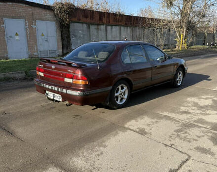 Красный Ниссан Максима, объемом двигателя 2 л и пробегом 284 тыс. км за 1800 $, фото 2 на Automoto.ua