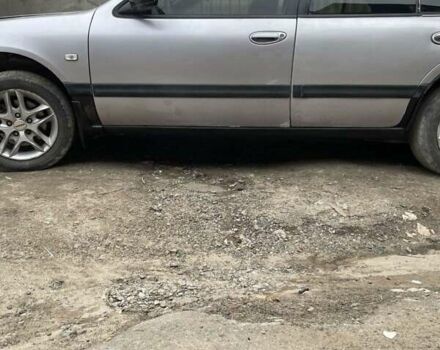 Серый Ниссан Максима, объемом двигателя 2 л и пробегом 280 тыс. км за 1250 $, фото 1 на Automoto.ua