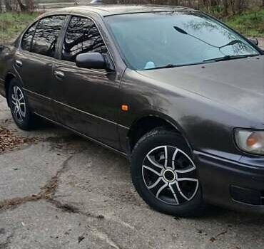 Серый Ниссан Максима, объемом двигателя 3 л и пробегом 300 тыс. км за 2600 $, фото 1 на Automoto.ua