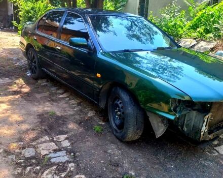 Зеленый Ниссан Максима, объемом двигателя 2 л и пробегом 321 тыс. км за 2200 $, фото 1 на Automoto.ua