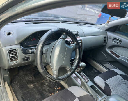 Зелений Ніссан Максіма, об'ємом двигуна 2 л та пробігом 470 тис. км за 1999 $, фото 6 на Automoto.ua