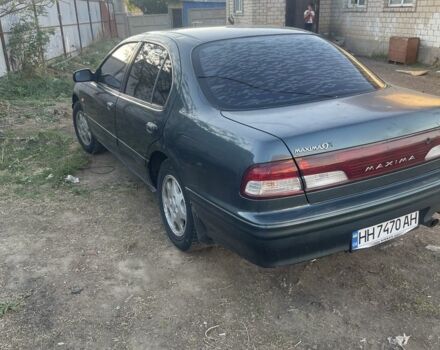 Зеленый Ниссан Максима, объемом двигателя 3 л и пробегом 258 тыс. км за 2450 $, фото 1 на Automoto.ua