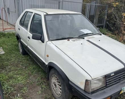 Білий Ніссан Мікра, об'ємом двигуна 1 л та пробігом 200 тис. км за 384 $, фото 5 на Automoto.ua