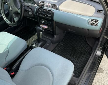 Черный Ниссан Микра, объемом двигателя 1 л и пробегом 260 тыс. км за 2800 $, фото 6 на Automoto.ua