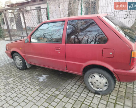 Червоний Ніссан Мікра, об'ємом двигуна 1 л та пробігом 432 тис. км за 1300 $, фото 1 на Automoto.ua