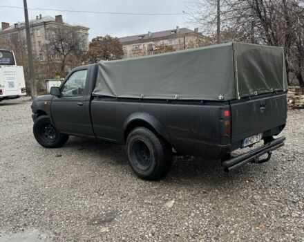 Черный Ниссан Навара, объемом двигателя 2.5 л и пробегом 1000 тыс. км за 3300 $, фото 3 на Automoto.ua