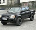 Черный Ниссан Навара, объемом двигателя 2.5 л и пробегом 297 тыс. км за 3999 $, фото 1 на Automoto.ua