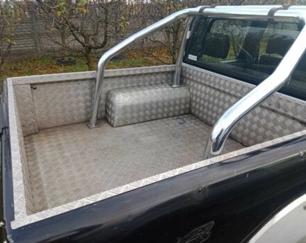 Чорний Ніссан Навара, об'ємом двигуна 2.5 л та пробігом 350 тис. км за 6174 $, фото 8 на Automoto.ua