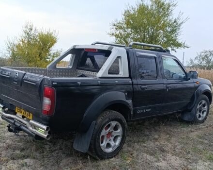 Черный Ниссан Навара, объемом двигателя 2.5 л и пробегом 100 тыс. км за 5300 $, фото 10 на Automoto.ua