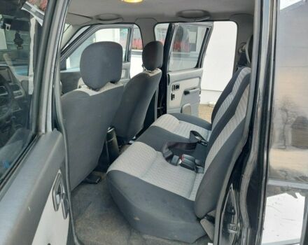 Чорний Ніссан Навара, об'ємом двигуна 2.5 л та пробігом 168 тис. км за 2649 $, фото 7 на Automoto.ua