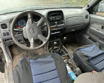 Черный Ниссан Навара, объемом двигателя 2.5 л и пробегом 200 тыс. км за 3450 $, фото 9 на Automoto.ua