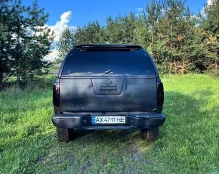 Черный Ниссан Навара, объемом двигателя 2.5 л и пробегом 200 тыс. км за 6100 $, фото 3 на Automoto.ua