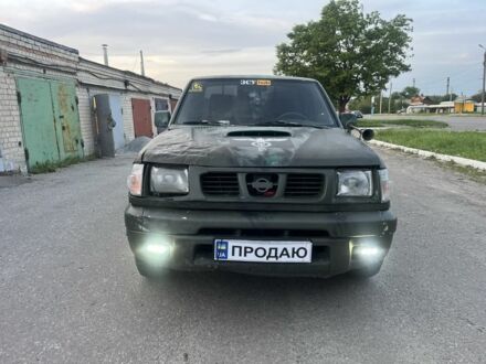 Черный Ниссан Навара, объемом двигателя 2.5 л и пробегом 238 тыс. км за 2999 $, фото 1 на Automoto.ua
