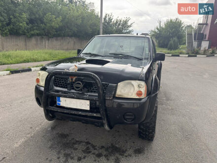 Черный Ниссан Навара, объемом двигателя 2.5 л и пробегом 230 тыс. км за 5000 $, фото 1 на Automoto.ua