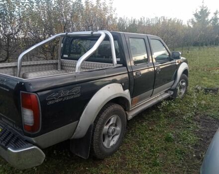 Чорний Ніссан Навара, об'ємом двигуна 2.5 л та пробігом 350 тис. км за 6174 $, фото 1 на Automoto.ua