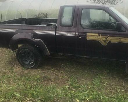 Коричневый Ниссан Навара, объемом двигателя 2.49 л и пробегом 290 тыс. км за 3786 $, фото 2 на Automoto.ua