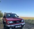 Красный Ниссан Навара, объемом двигателя 2.5 л и пробегом 250 тыс. км за 4199 $, фото 1 на Automoto.ua