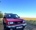 Червоний Ніссан Навара, об'ємом двигуна 2.5 л та пробігом 250 тис. км за 4199 $, фото 1 на Automoto.ua