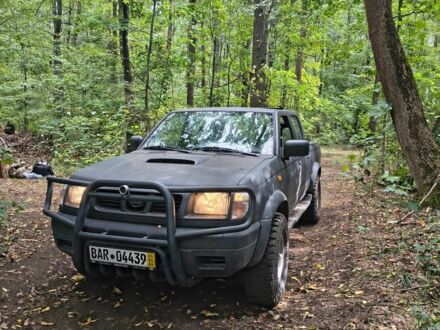 Сірий Ніссан Навара, об'ємом двигуна 2.5 л та пробігом 150 тис. км за 4853 $, фото 1 на Automoto.ua
