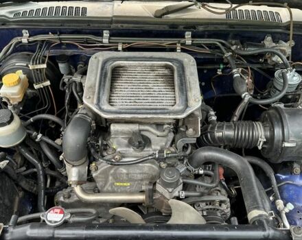 Синий Ниссан Навара, объемом двигателя 2.5 л и пробегом 281 тыс. км за 4000 $, фото 7 на Automoto.ua