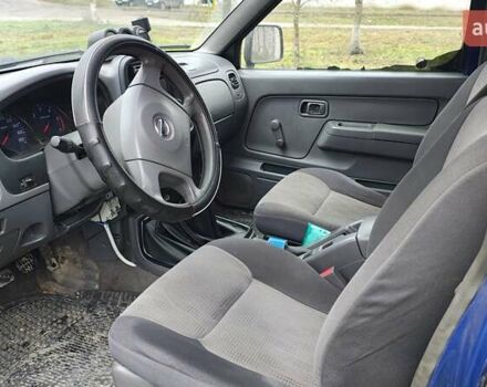 Синій Ніссан Навара, об'ємом двигуна 2.5 л та пробігом 316 тис. км за 7246 $, фото 6 на Automoto.ua