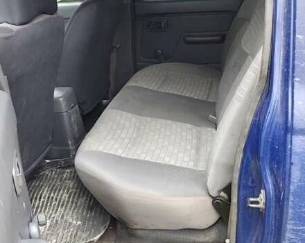 Синій Ніссан Навара, об'ємом двигуна 2.5 л та пробігом 316 тис. км за 7246 $, фото 9 на Automoto.ua