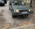 Зеленый Ниссан Навара, объемом двигателя 2.5 л и пробегом 300 тыс. км за 2000 $, фото 7 на Automoto.ua
