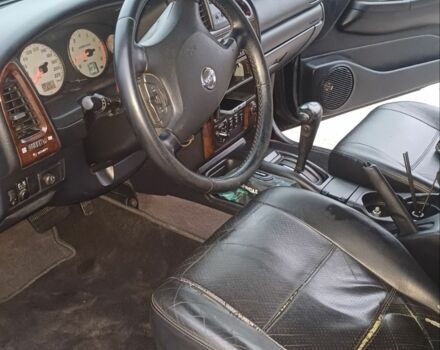 Черный Ниссан Патфайндер, объемом двигателя 3.5 л и пробегом 286 тыс. км за 4637 $, фото 10 на Automoto.ua