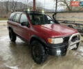 Червоний Ніссан Патфайндер, об'ємом двигуна 2.5 л та пробігом 350 тис. км за 3850 $, фото 1 на Automoto.ua