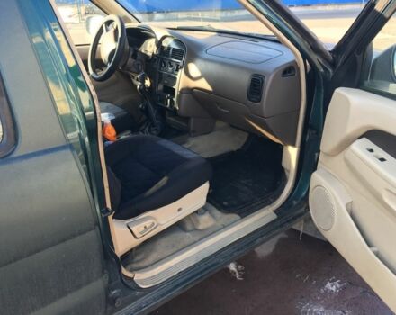 Зеленый Ниссан Патфайндер, объемом двигателя 3 л и пробегом 321 тыс. км за 4200 $, фото 5 на Automoto.ua