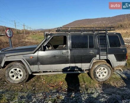 Черный Ниссан Патрол, объемом двигателя 2.8 л и пробегом 300 тыс. км за 5250 $, фото 5 на Automoto.ua