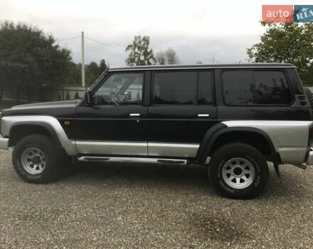 Чорний Ніссан Патрол, об'ємом двигуна 2.8 л та пробігом 306 тис. км за 12000 $, фото 2 на Automoto.ua