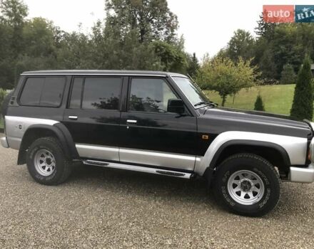 Чорний Ніссан Патрол, об'ємом двигуна 2.8 л та пробігом 306 тис. км за 12000 $, фото 1 на Automoto.ua