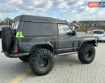 Черный Ниссан Патрол, объемом двигателя 2.8 л и пробегом 300 тыс. км за 12000 $, фото 16 на Automoto.ua