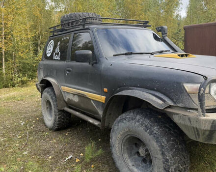 Черный Ниссан Патрол, объемом двигателя 2.83 л и пробегом 307 тыс. км за 15000 $, фото 7 на Automoto.ua