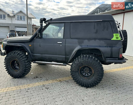 Черный Ниссан Патрол, объемом двигателя 2.8 л и пробегом 300 тыс. км за 12000 $, фото 27 на Automoto.ua