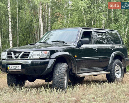 Черный Ниссан Патрол, объемом двигателя 3 л и пробегом 390 тыс. км за 11750 $, фото 1 на Automoto.ua