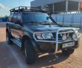 Черный Ниссан Патрол, объемом двигателя 3 л и пробегом 405 тыс. км за 15000 $, фото 1 на Automoto.ua
